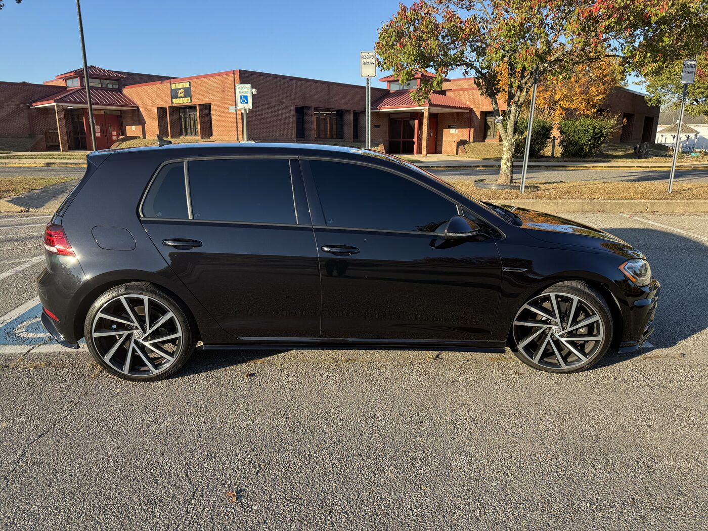 Mirror-finish black VW Golf R with ceramic tint all around